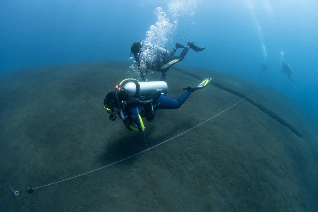 PADI Advanced Open Water student practicing underwater navigation in Tulamben, Bali