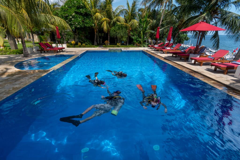 Youngsters taking their diving certificate in Tulamben, Bali, Indonesia
